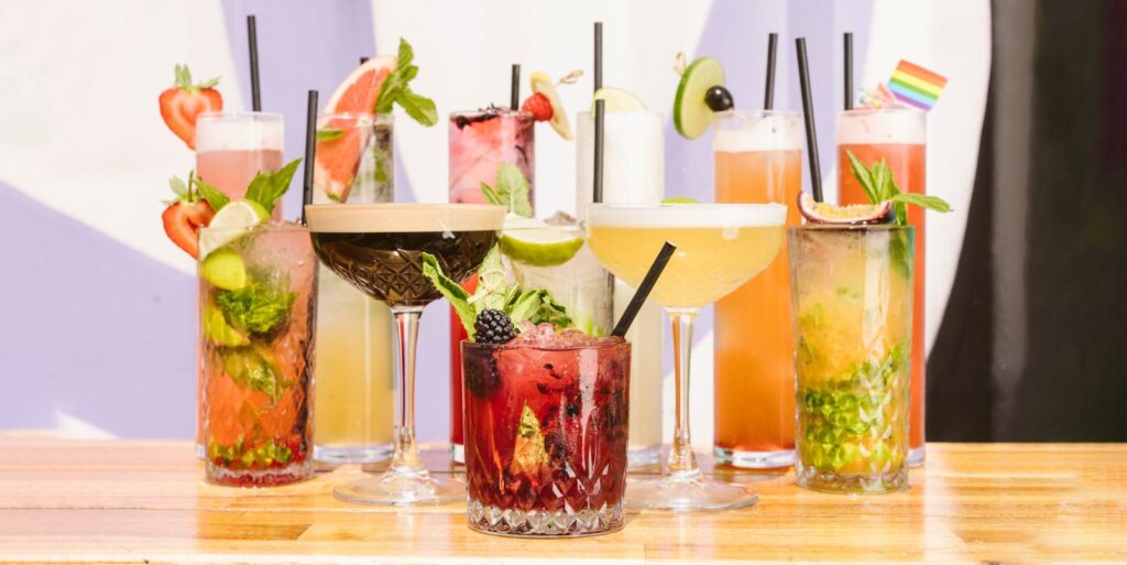 A photo of 10 different cocktails
