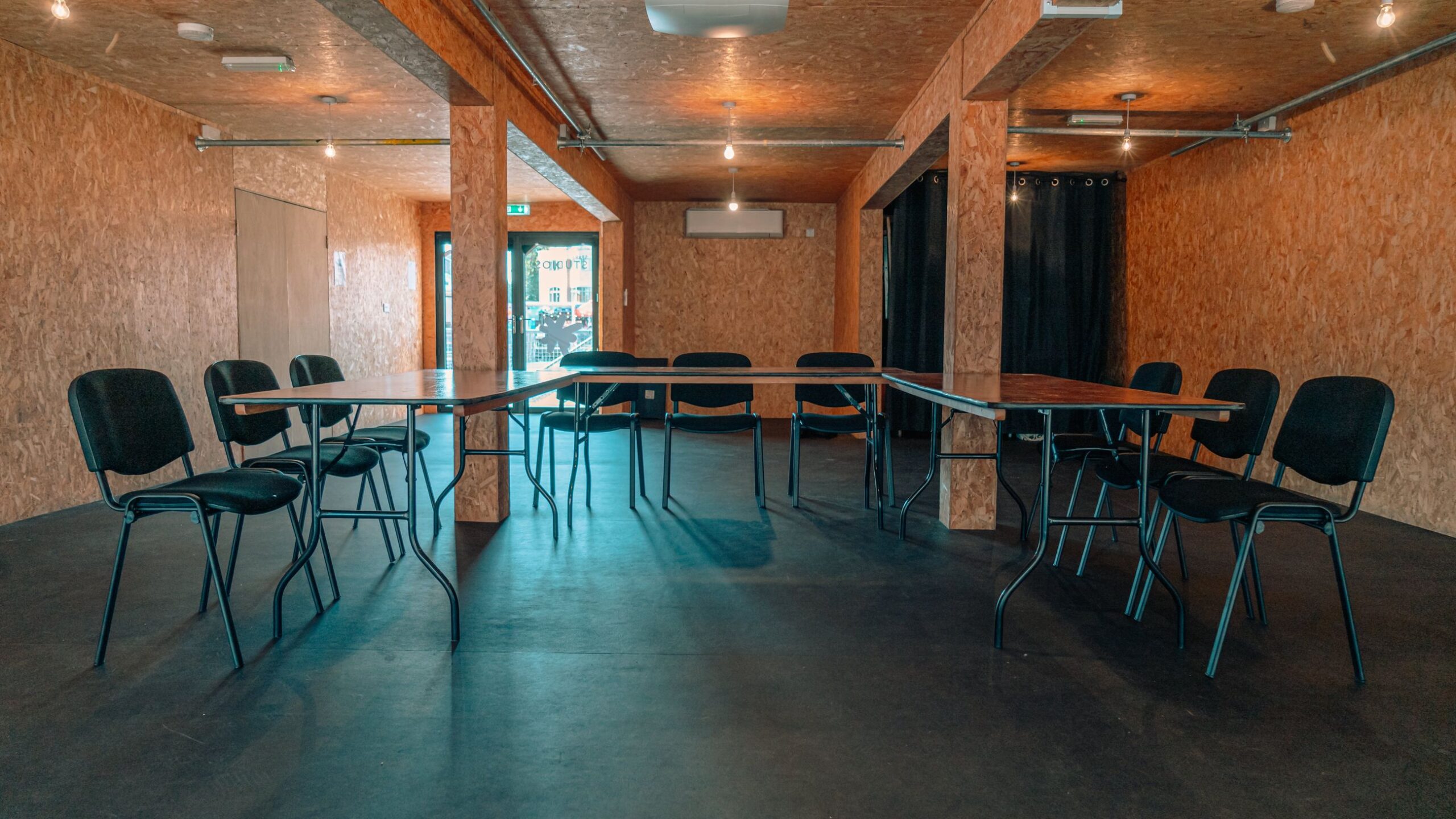 The Show space set up with a U table with chairs