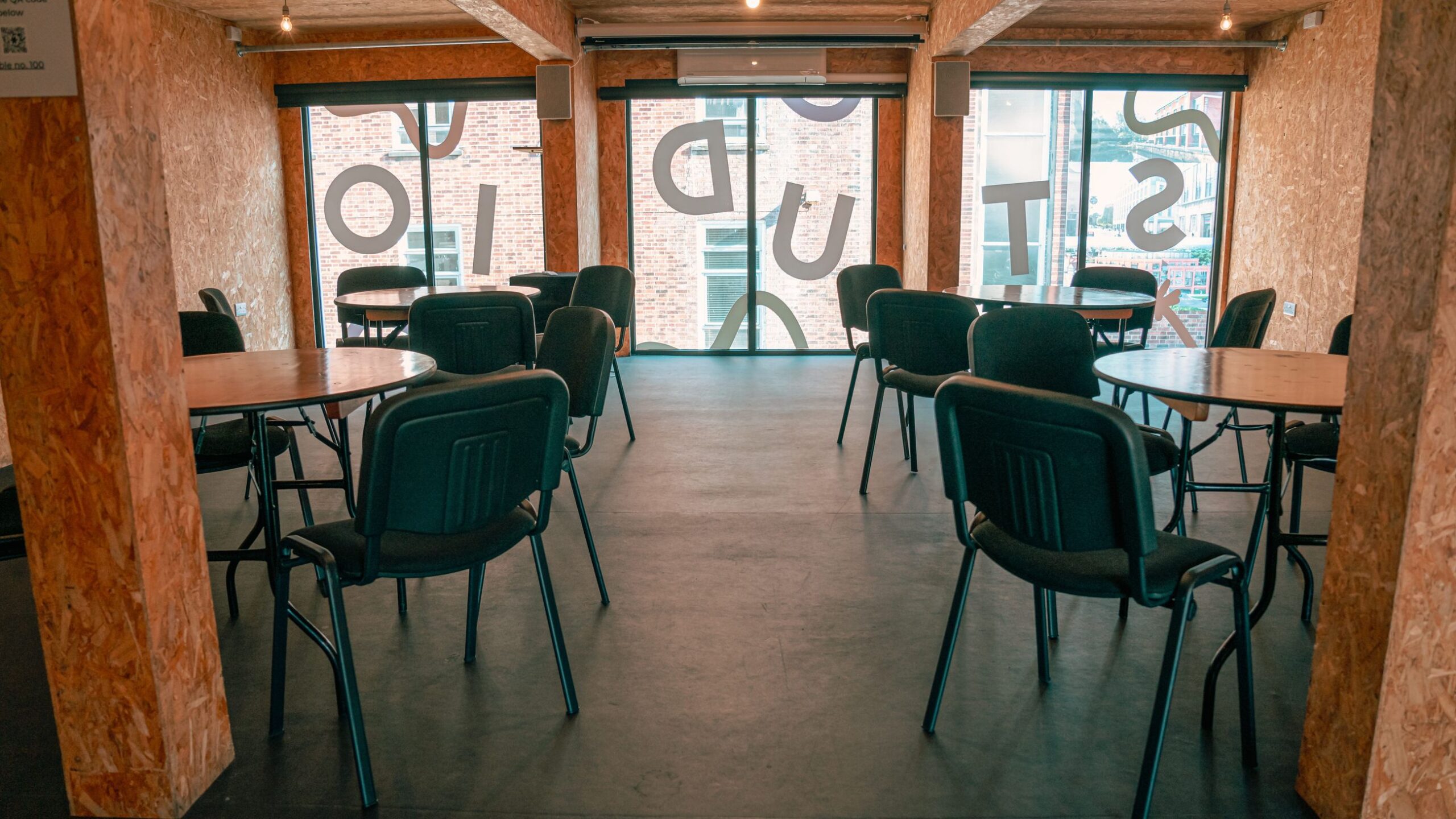The Show space set up with circular tables and chairs