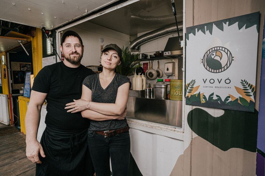 A man and woman smiling outside Vovo