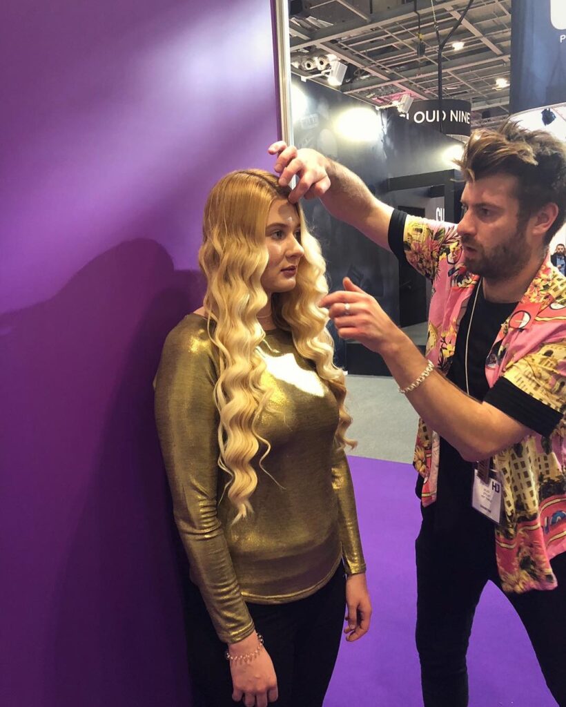 A woman getting her hair styled