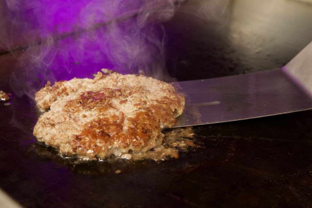 A smashed burger on the grill