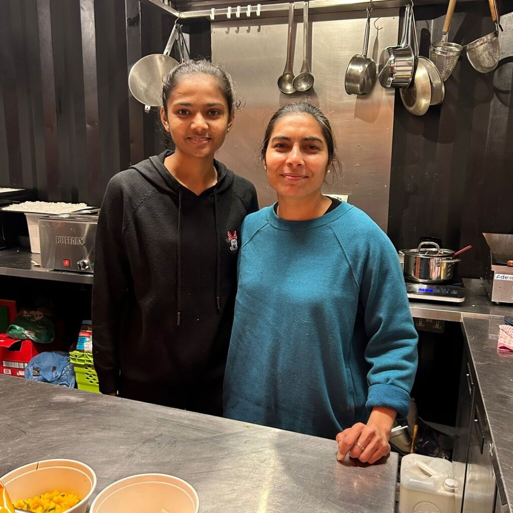A photo of two women smiling in a unit